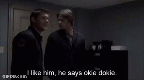 Two Men Standing Next To Each Other With The Words I Like Him He Says Okie Dokie GIF