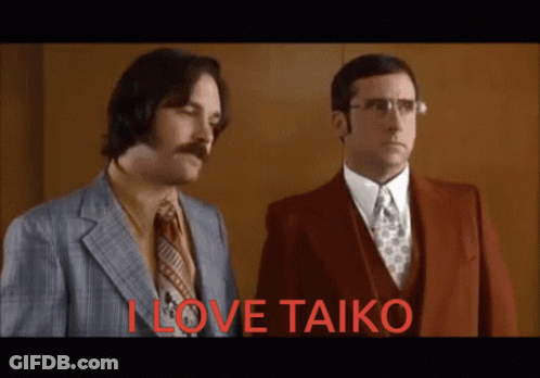 Two Men Standing Next To Each Other With The Words " I Love Taiko " In Red Letters GIF