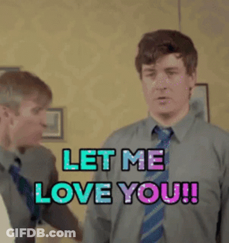 Two Men Standing Next To Each Other With The Words Let Me Love You GIF