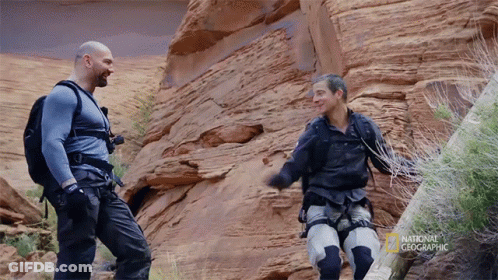 Two Men Standing Next To Each Other With The Words National Geographic On The Bottom GIF