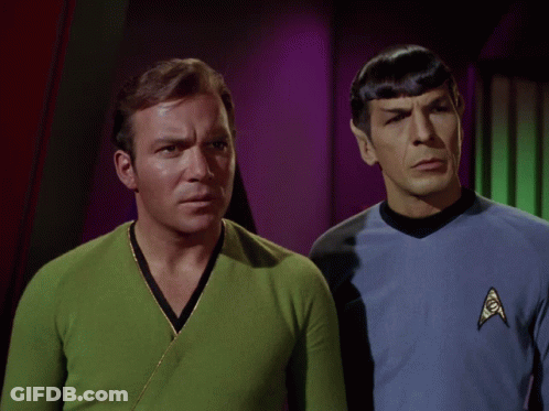 Two Men Standing Next To Each Other With The Words " The What " Written Above Them GIF