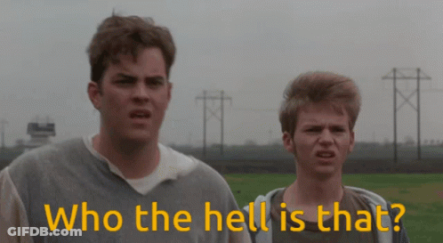 Two Men Standing Next To Each Other With The Words " Who The Hell Is That " In Yellow GIF