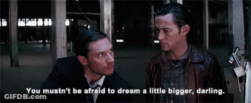 Two Men Standing Next To Each Other With The Words " You Mustn 'T Be Afraid To Dream A Little Bigger Darling " GIF