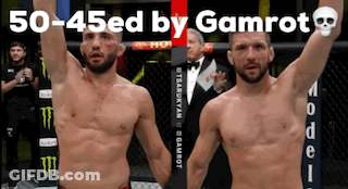 Two Men Standing Next To Each Other With Their Arms In The Air And The Words 50-45Ed By Gamrot GIF