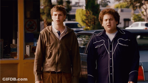Two Men Standing Next To No Dogs Sign GIF