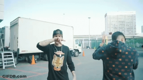 Two Men Standing Next To Truck GIF