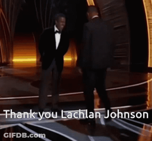 Two Men Standing On A Stage With The Words Thank You Lachlan Johnson On The Bottom GIF