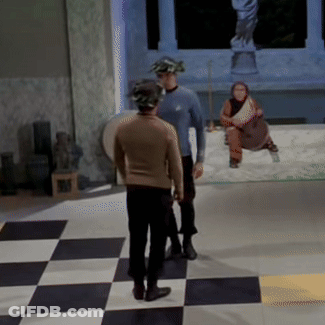 Two Men Standing On Checkered Floor GIF