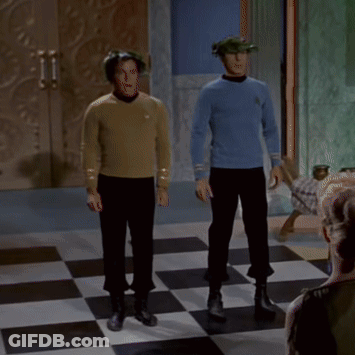 Two Men Standing On Checkered Floor GIF