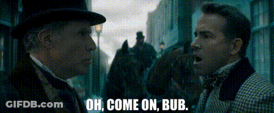 Two Men Standing On City Street GIF