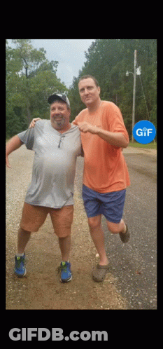 Two Men Standing On Dirt Road GIF