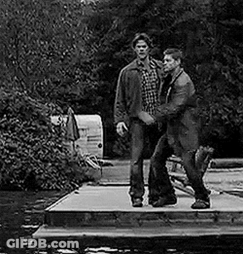 Two Men Standing On Dock By River GIF