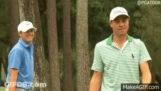 Two Men Standing On Golf Course GIF