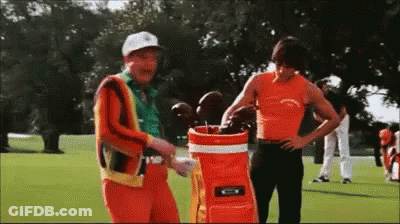 Two Men Standing On Golf Course GIF