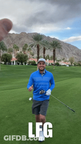 Two Men Standing On Golf Course With Golf Bag GIF