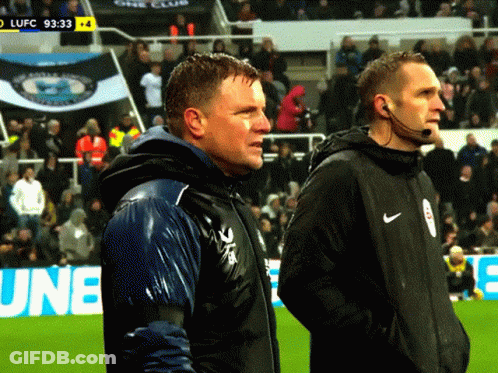 Two Men Standing On Soccer Field GIF