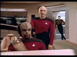 Two Men Standing On Spaceship GIF