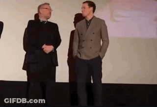 Two Men Standing On Stage GIF