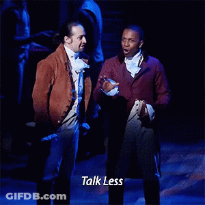 Two Men Standing On Stage Talking GIF
