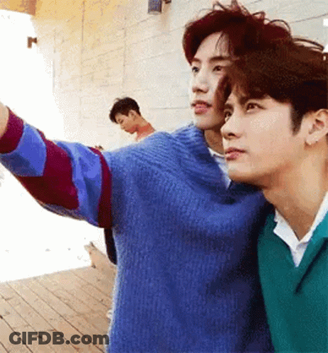 Two Men Standing On Wooden Deck GIF