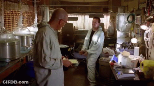Two Men Standing One Holding Paper GIF