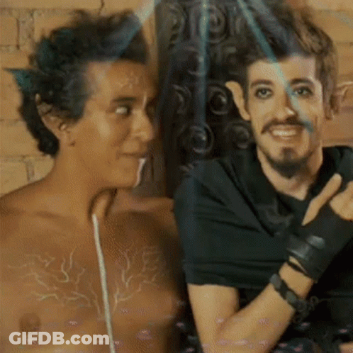 Two Men Standing, One In Black Shirt GIF