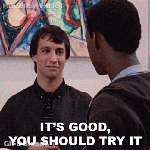 Two Men Standing One Saying It's Good You Should Try It GIF