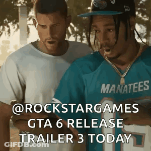 Two Men Standing One Wearing Blue Manatees Shirt GIF