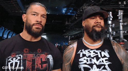 Two Men Standing, One Wearing RTC T-Shirt GIF