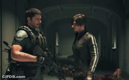 Two Men Standing One With Gun GIF