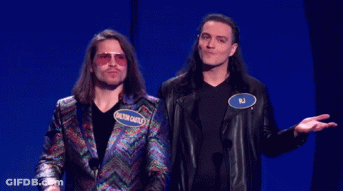 Two Men Standing One With RJ Name Tag GIF