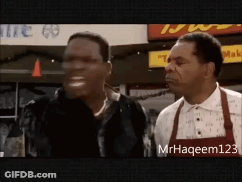 Two Men Standing Outside Restaurant GIF