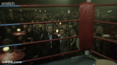 Two Men Standing Saying Snatch GIF