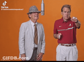 Two Men Standing Side By Side One Wearing Shirt Saying A GIF