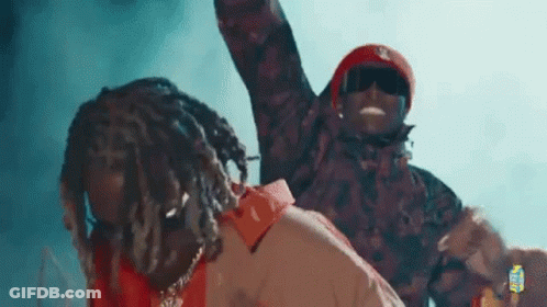 Two Men Standing Together On Stage GIF