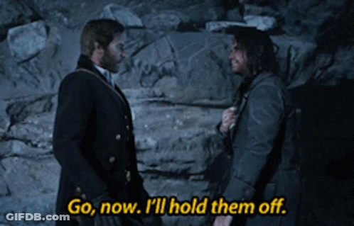 Two Men Standing Together Saying Go Now I'll Hold Them Off GIF