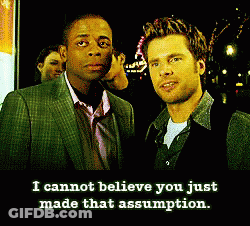 Two Men Standing With Caption I Cannot Believe You Just Made That Assumption GIF