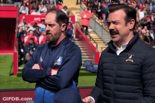 Two Men Standing With Goat Jacket GIF