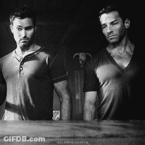 Two Men Standing With Halfwinchester GIF