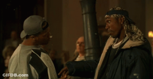 Two Men Standing With Popcorn On Screen GIF