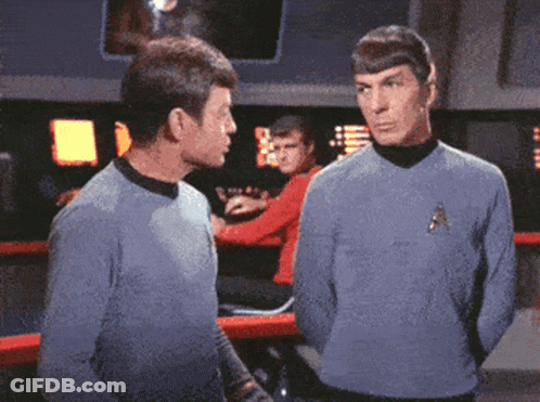 Two Men Standing With Star Trek Logo GIF