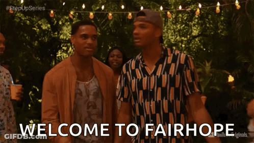 Two Men Standing With Welcome To Fairhope Text GIF