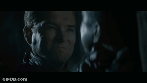 Two Men Staring In Dark One Smiling GIF