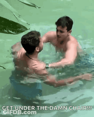 Two Men Swimming In Pool Get Under The Damn Chair GIF
