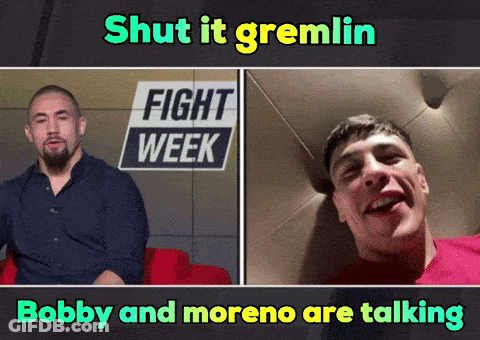 Two Men Talking At Fight Week Sign GIF