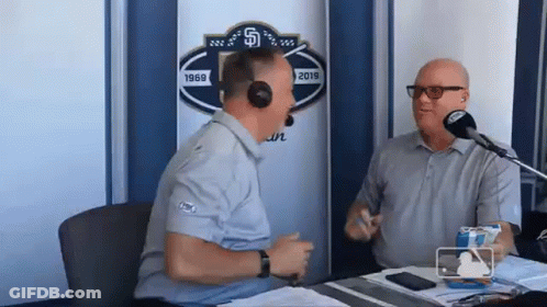 Two Men Talking At Microphone GIF