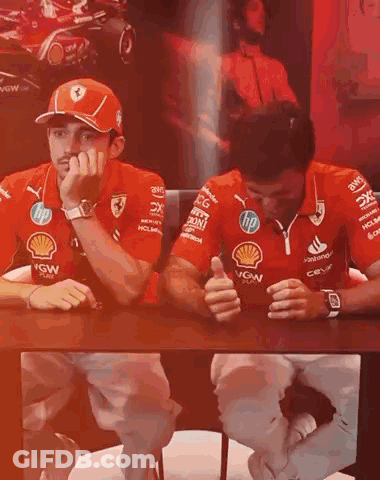 Two Men Talking At Table GIF