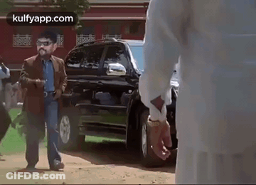 Two Men Talking By Open Trunk GIF
