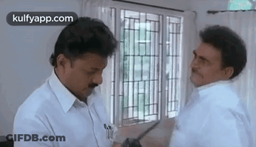 Two Men Talking By Window GIF