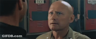 Two Men Talking In Front Of Ice Locker GIF